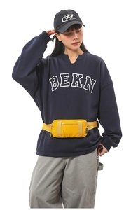 Detail of a bright yellow multifunctional sports waist bag with adjustable buckle strap
