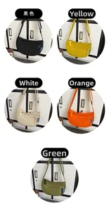 Detail showing colorful nylon crescent crossbody bags in five vibrant shades with straps