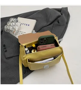 Top view of bright yellow PU leather bag showing internal compartments and storage capacity