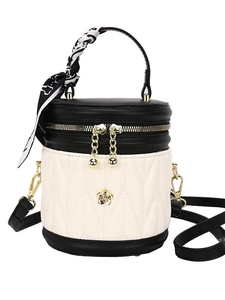 Black and white quilted bucket bag with camellia detail and silk scarf handle
