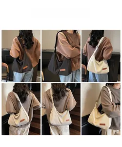 Multiple views of large canvas hobo bags showing black and off-white shoulder style