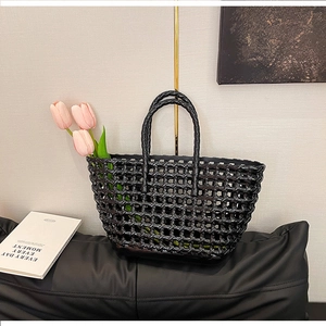 Black woven hollow silicone tote bag with twin handles and grid texture design