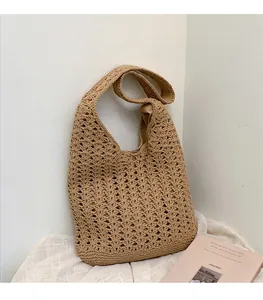 Detail view of khaki crochet cotton shoulder bag with hollow geometric knit texture