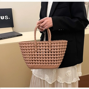 Close-up of nude pink hollow woven jelly handbag featuring a textured basket pattern