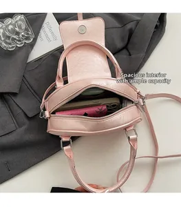 Internal view of the pink shell bag showing spacious capacity for phone and wallet