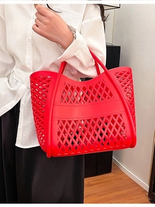 Vibrant red hollow-out silicone tote bag with diamond mesh design and dual handles