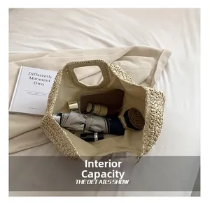 Detailed interior of a beige straw tote bag showing large capacity for daily essentials