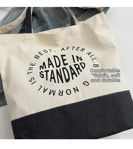 Détail du sac cabas en toile avec lettres imprimées en tissu doux et durable de qualité