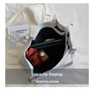 Top view of large capacity white tote bag interior with zipper and daily essentials