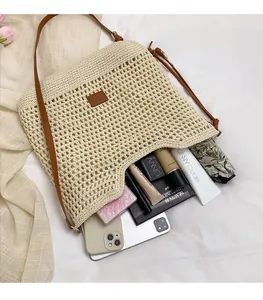 Detail view of beige crochet tote bag showing spacious interior with personal essentials