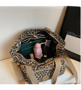 Detailed interior of a leopard print tote bag showing large capacity for daily essentials