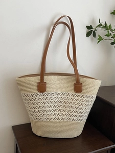 Minimalist straw tote bag with geometric hollow weave and brown leather handles