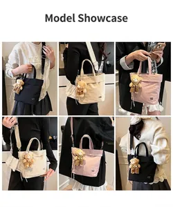 Close-up of stylish canvas tote bags showing textured fabric and bear keychain