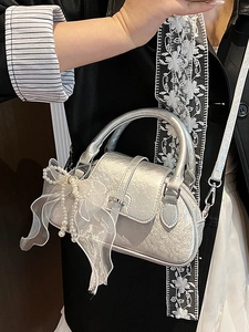 Chic silver bow shell bag for women with pearl trim and detachable shoulder strap