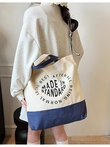 Minimalist canvas tote bag for women with navy patchwork base and adjustable strap