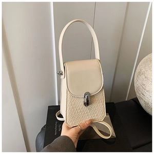 Detail of cream square phone bag with crocodile texture and silver metal twist lock