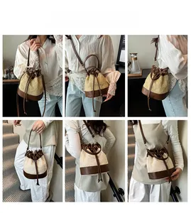 Detail of straw drawstring bucket bag with leather trim and adjustable shoulder strap
