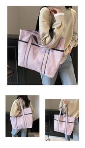 Detail of light purple large tote bag featuring black contrast straps and spacious interior
