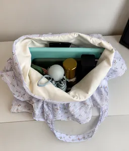 Internal view of the floral tote bag showing large capacity for tablet and accessories