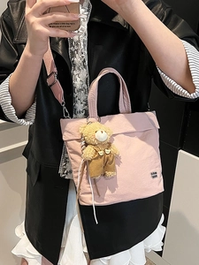 Pink canvas tote bag with cute bear pendant and adjustable strap for women