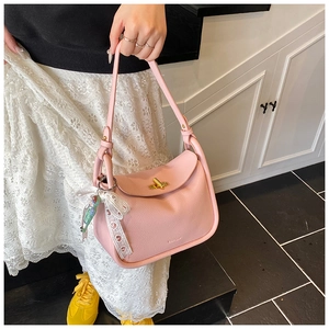 Pink lychee texture crossbody bag with lace bow and golden metal lock detail