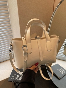Chic cream white PU leather tote bag with top handles and adjustable shoulder strap