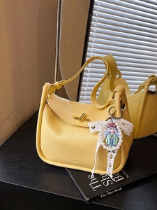 Yellow pebbled leather hobo shoulder bag with gold twist lock and pearl bow charm