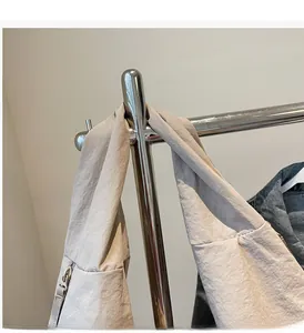 Detail of durable gray tote bag shoulder strap with high-quality zipper and clean finish