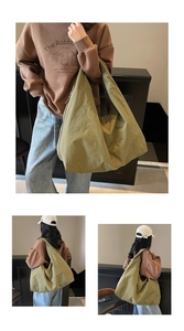Close-up and back view of a large olive green nylon tote bag with crinkle texture