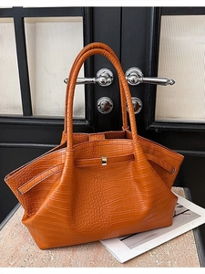 Chic orange crocodile embossed leather tote bag with gold buckle and top handles