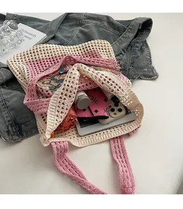 Interior view of the crochet knit tote bag showing large capacity with daily essentials
