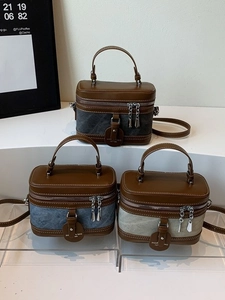 Three vintage box bags in grey, blue, and beige with brown leather trim and silver chains