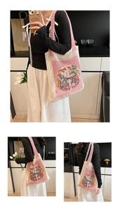 Detail of knit tote bag featuring traditional dragon embroidery and pink crochet mesh