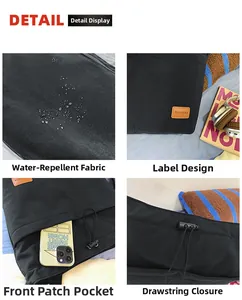 Detail von wasserabweisendem Nylon-Stoff, Lederetikett und Kordelzug-Verschluss am Shopper