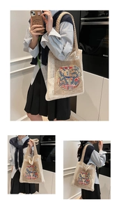 Detail of woven mesh tote with dragon embroidery and traditional Chinese frog fasteners