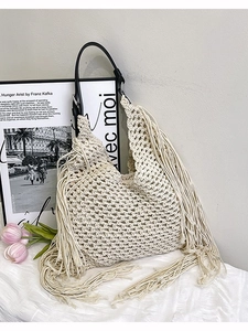 Bohemian off-white crochet shoulder bag with fringes and black leather strap