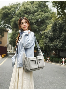 Close-up of waterproof nylon crossbody bag with large capacity and multi-pocket details