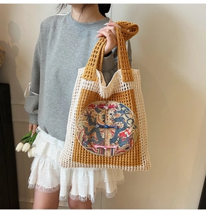 Close-up of woven tote bag with dragon embroidery and colorful traditional Chinese buttons