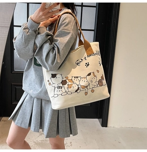 Fashionable canvas tote bag with cat print and Valentine's Day text on shoulder strap