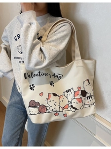 Off-white canvas tote bag featuring cute hand-drawn cartoon cats for Valentine's day