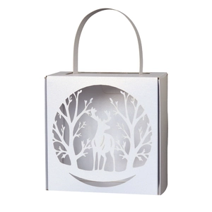White laser cut Christmas reindeer candy gift box with tree silhouette and handle