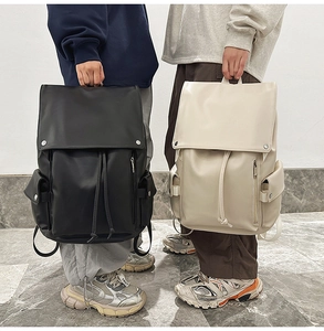 Minimalist matte PU leather backpacks in black and cream white with magnetic flap closures