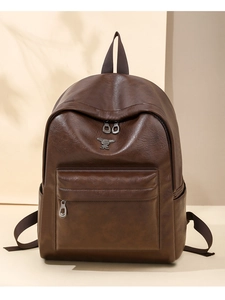 Detailed view of deep brown vintage leather backpack with rabbit hardware and zipper pockets