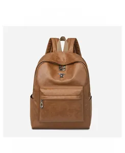 Front detail of brown leather backpack with silver rabbit logo and dual zipper pockets