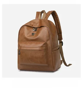 Detailed side view of a brown vintage leather backpack with dual zippers and side pockets