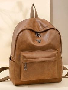 Classic caramel brown leather backpack for women with stylish metal rabbit charm detail