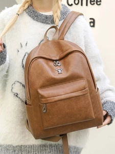 Deep brown faux leather backpack with silver rabbit charm and large capacity casual style