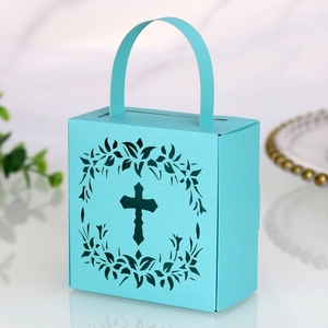 Detail of laser-cut cross and wreath on mint green wedding favors paper gift box
