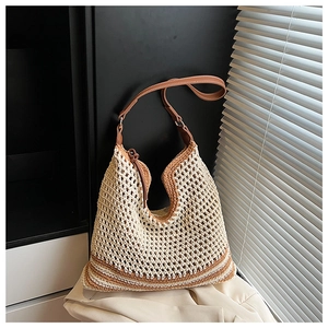 Detail of hollow straw weave texture and contrast brown trim on minimalist beige shoulder bag