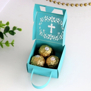 Detail of mint green laser-cut cross gift box showing internal space for chocolates